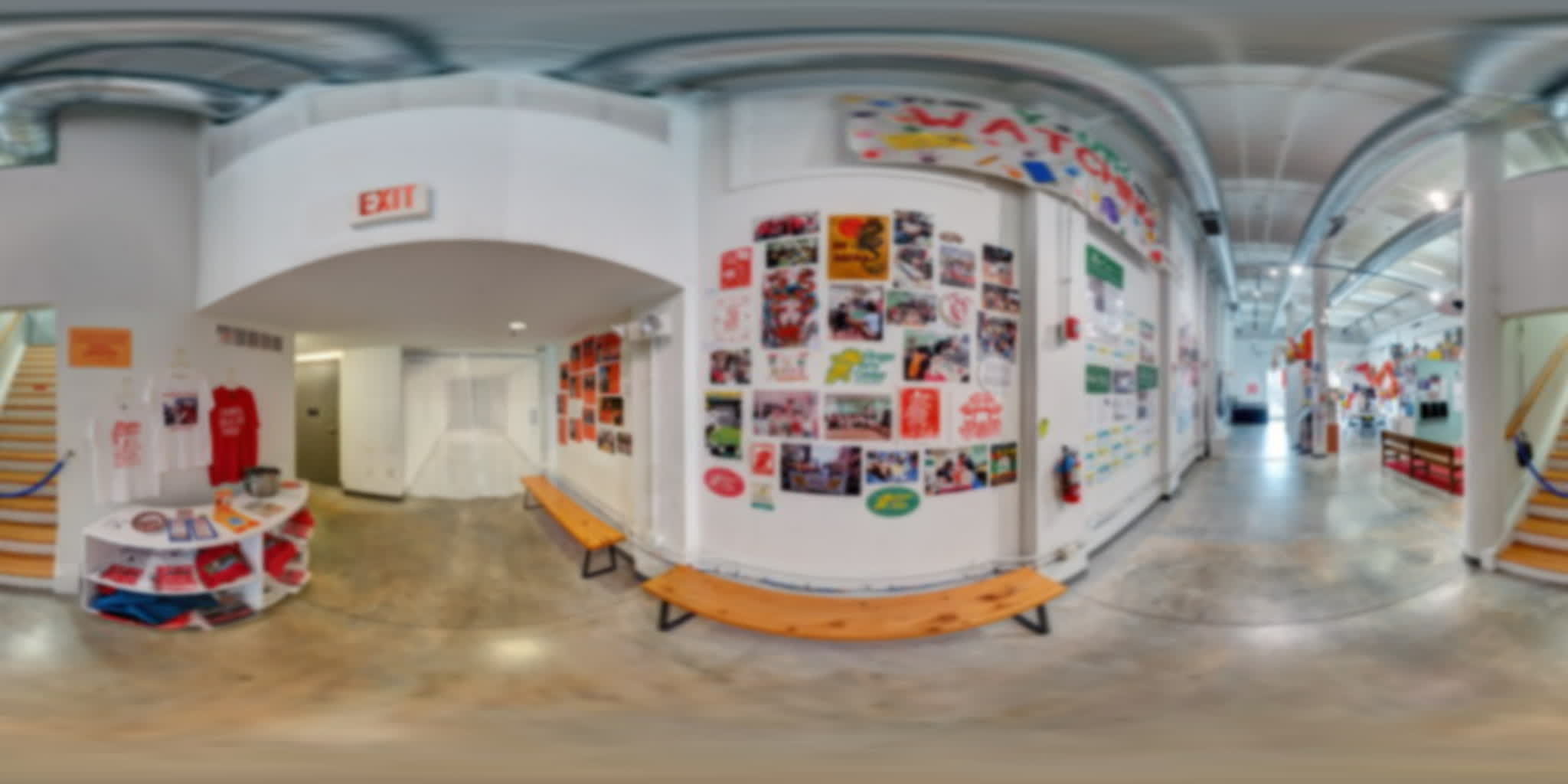 Ginger Arts Center wall filled with youth-organizing photographs, artwork, and flyers.
