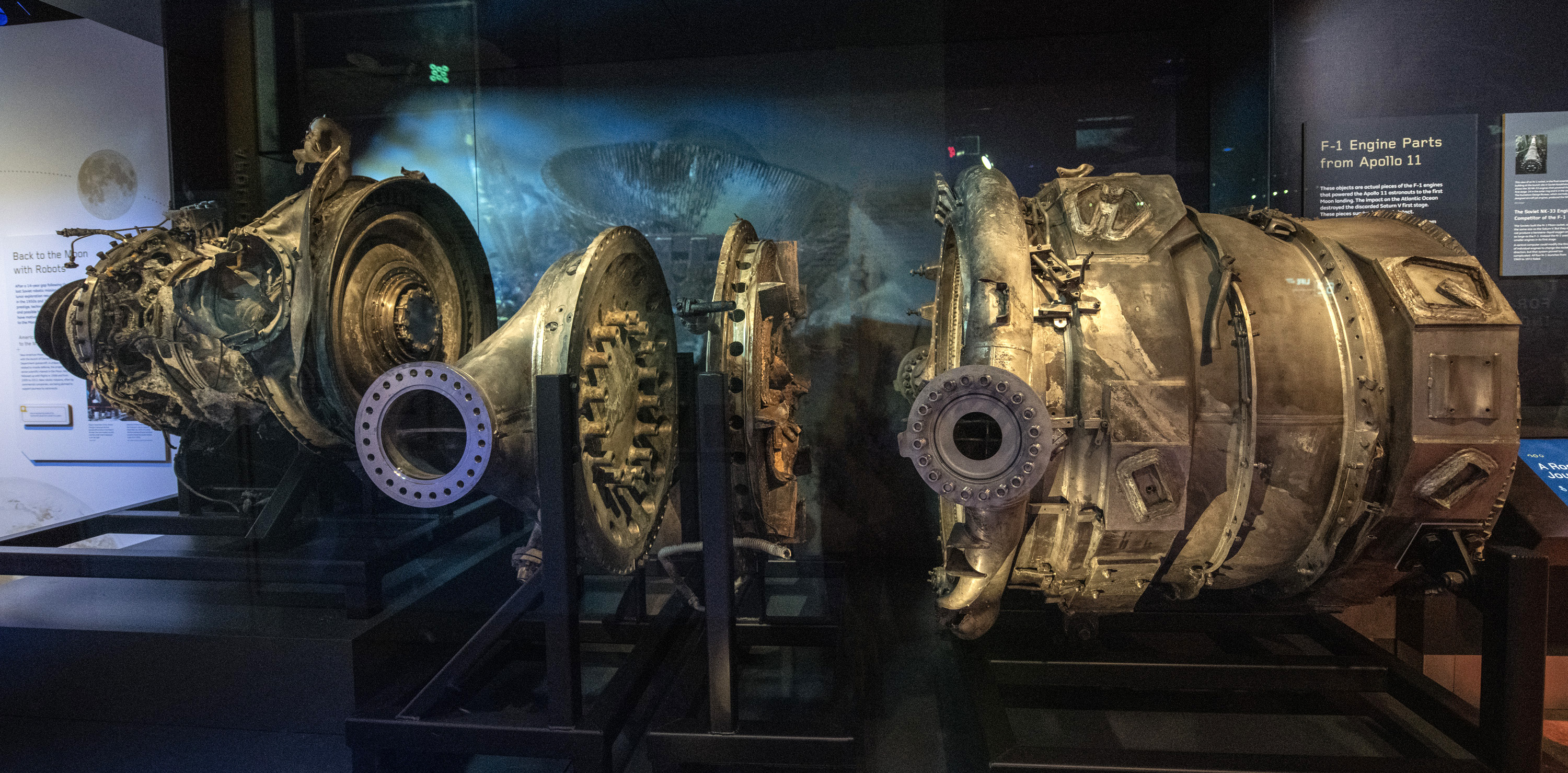 Long twisted and corroded F-1 engine components recovered from the Atlantic Ocean floor, with rivets and heavy impact damage.