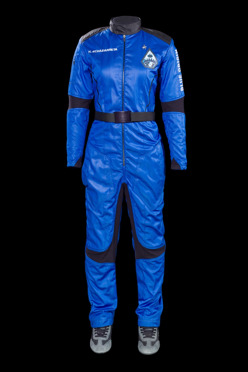 An electric-blue one-piece flight suit with mission patches, custom-made for Katya Echazarreta’s Blue Origin NS-21 mission.