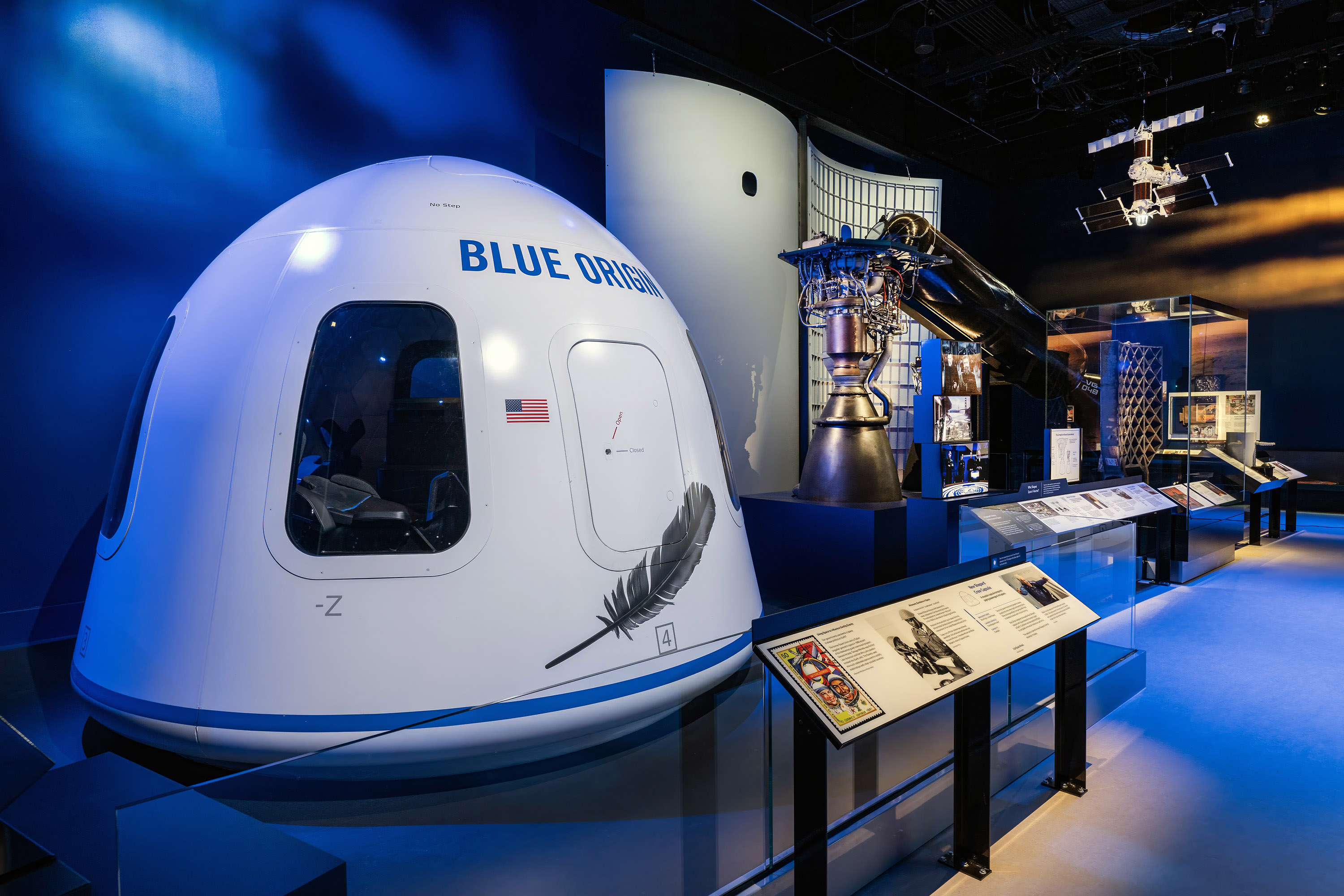 A large white crew capsule for up to six passengers with broad windows for views of Earth.