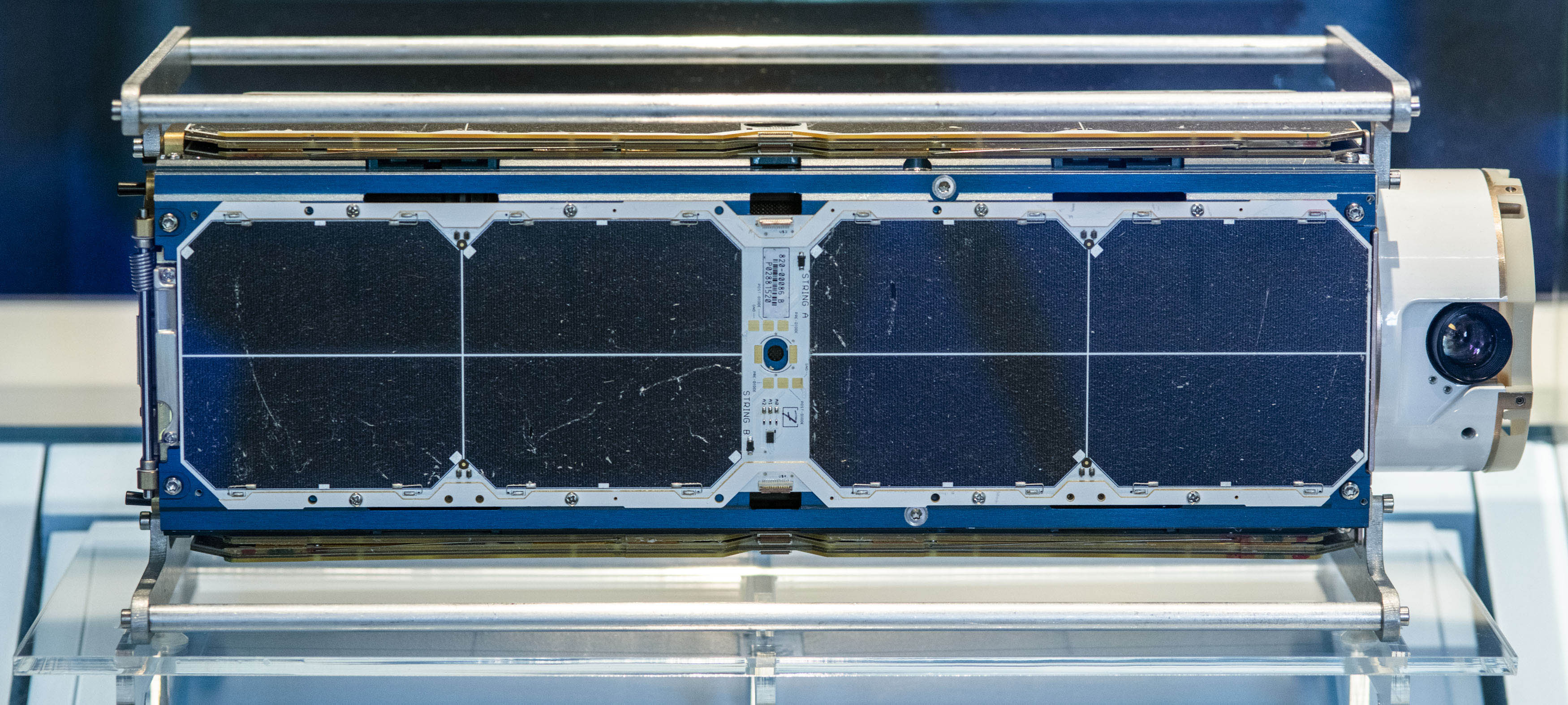 Small black-and-white rectangular imaging satellite built from three standardized cube-sized sections.