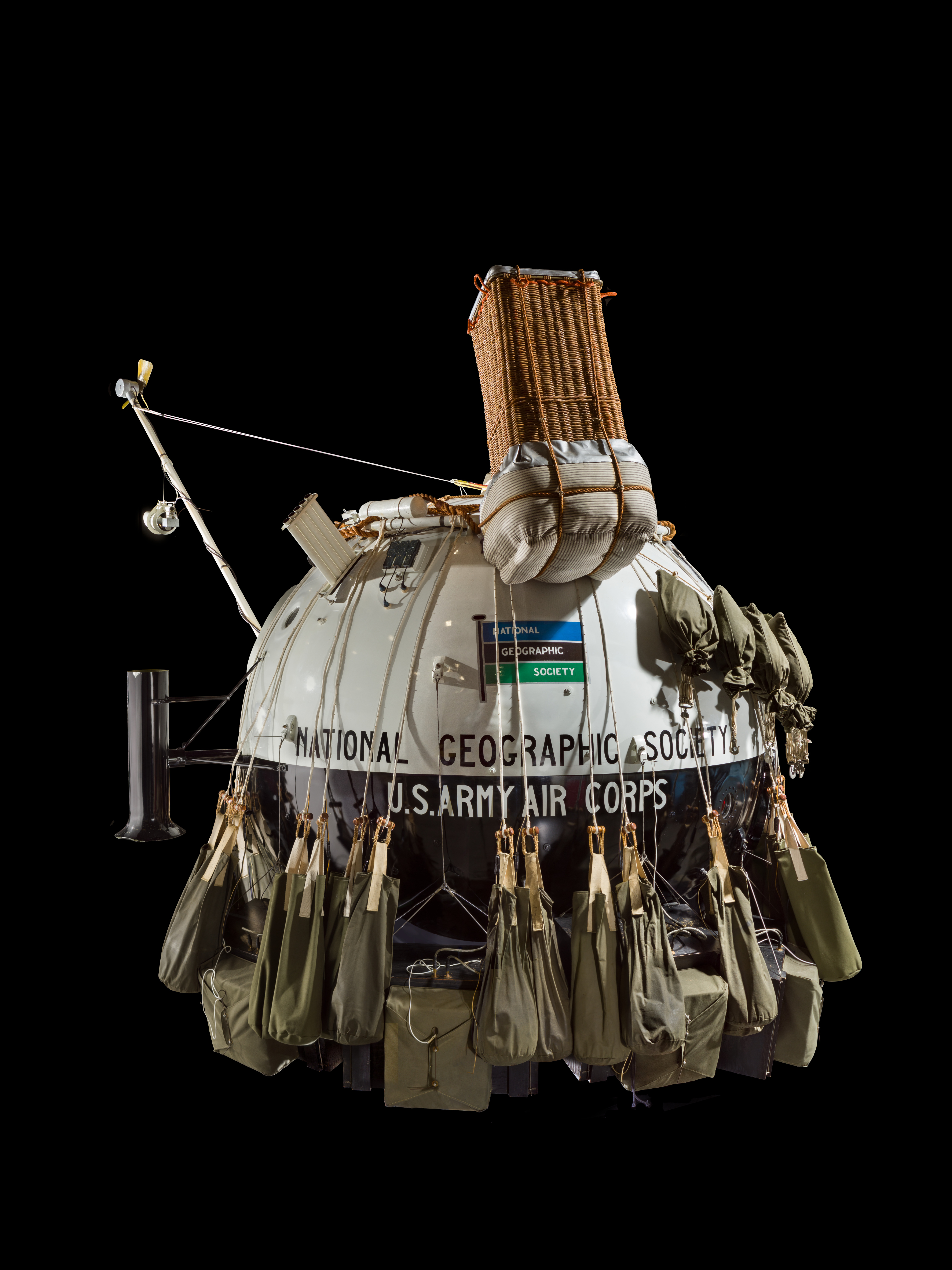 Black-and-white spherical Explorer II pressure gondola with external ballast and instrument equipment.