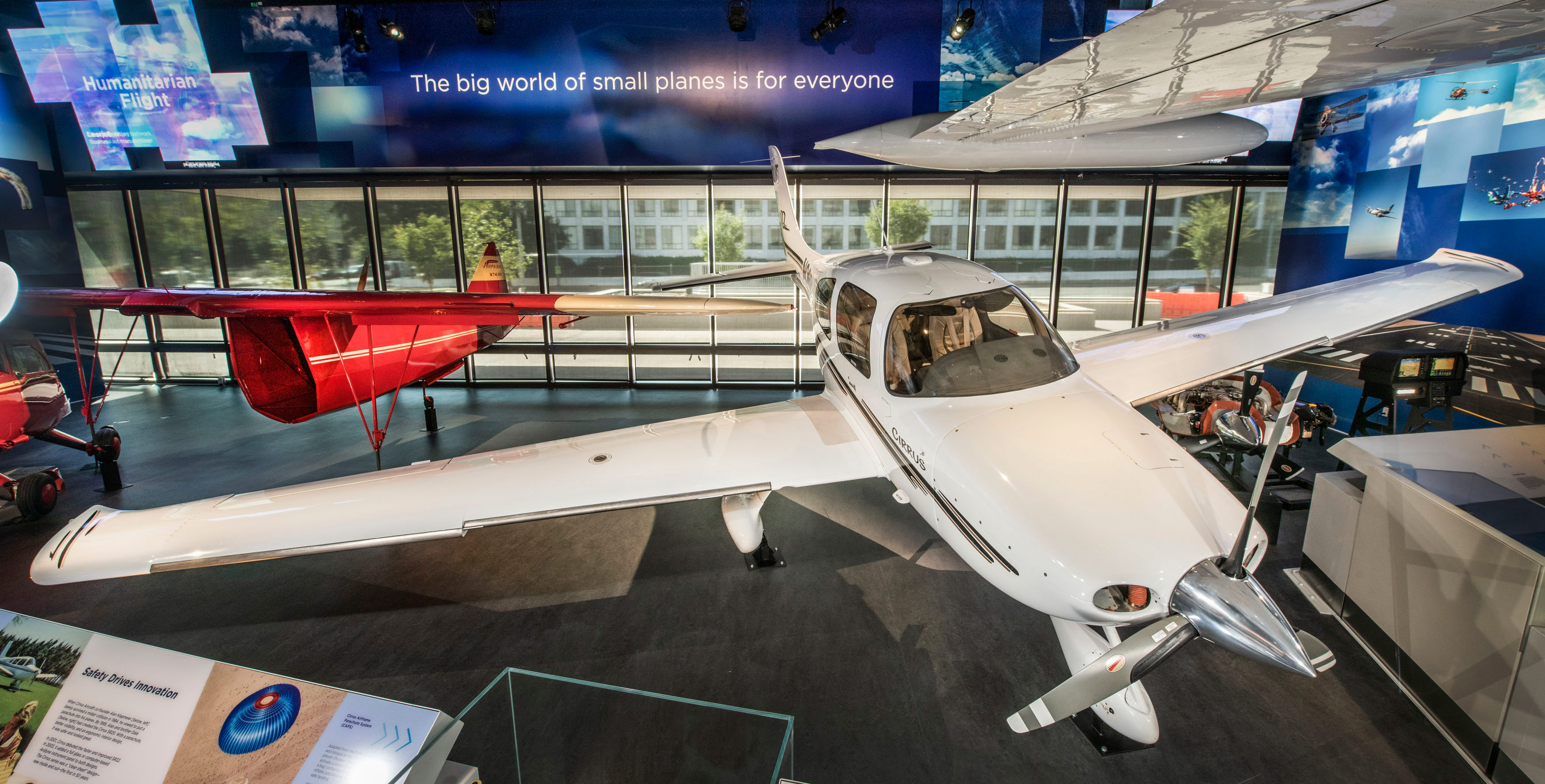 White four-seat Cirrus SR22 with a low wing, fixed landing gear, composite body, and whole-aircraft parachute system.