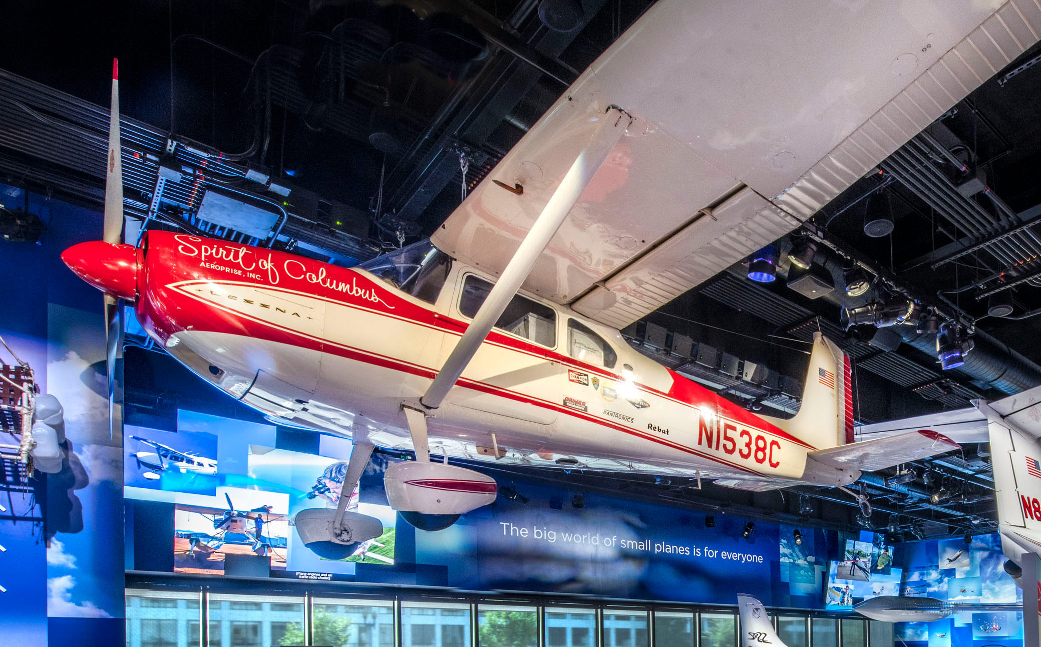 Red and white high-wing Cessna 180 with a single engine, tailwheel landing gear, and four-seat cabin.