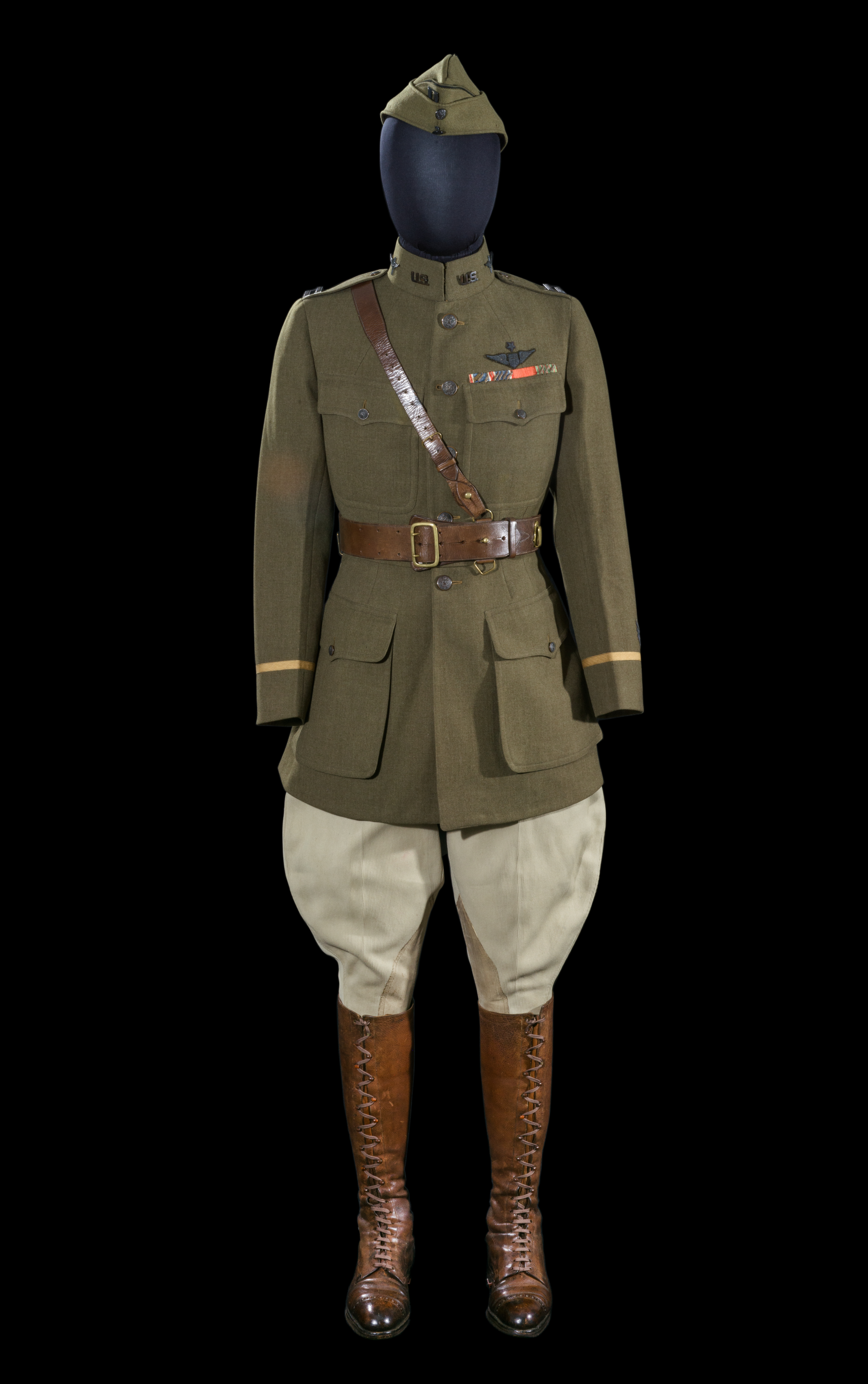 Olive-drab U.S. Army Air Service officer's uniform with ribbons, insignia, trousers, and tall boots.