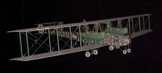 Scale model of a large German six-engine biplane bomber in lozenge camouflage.