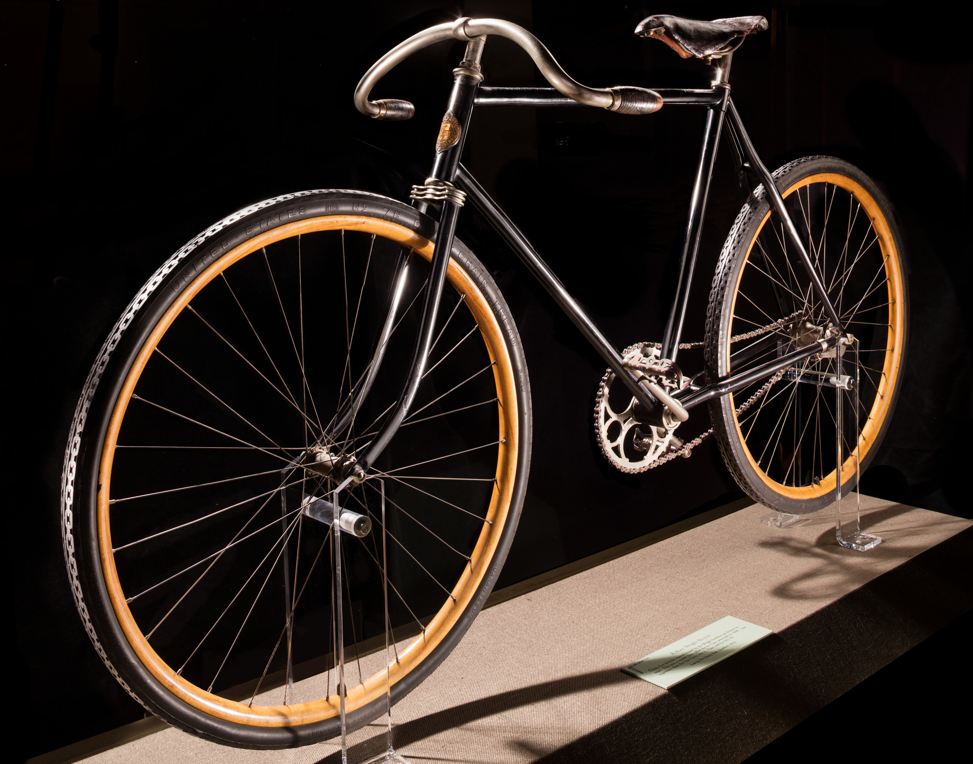 Black St. Clair safety bicycle with low curved handlebars, two equal-size wheels, and a diamond-shaped frame.
