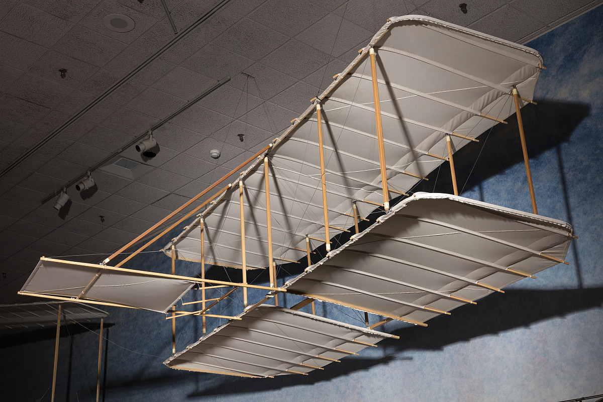 Fabric-covered wooden biplane glider with no vertical tail and a horizontal forward elevator.