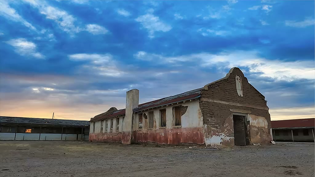 Evening light across the historic adobe buildings of Rio Vista in Socorro, Texas